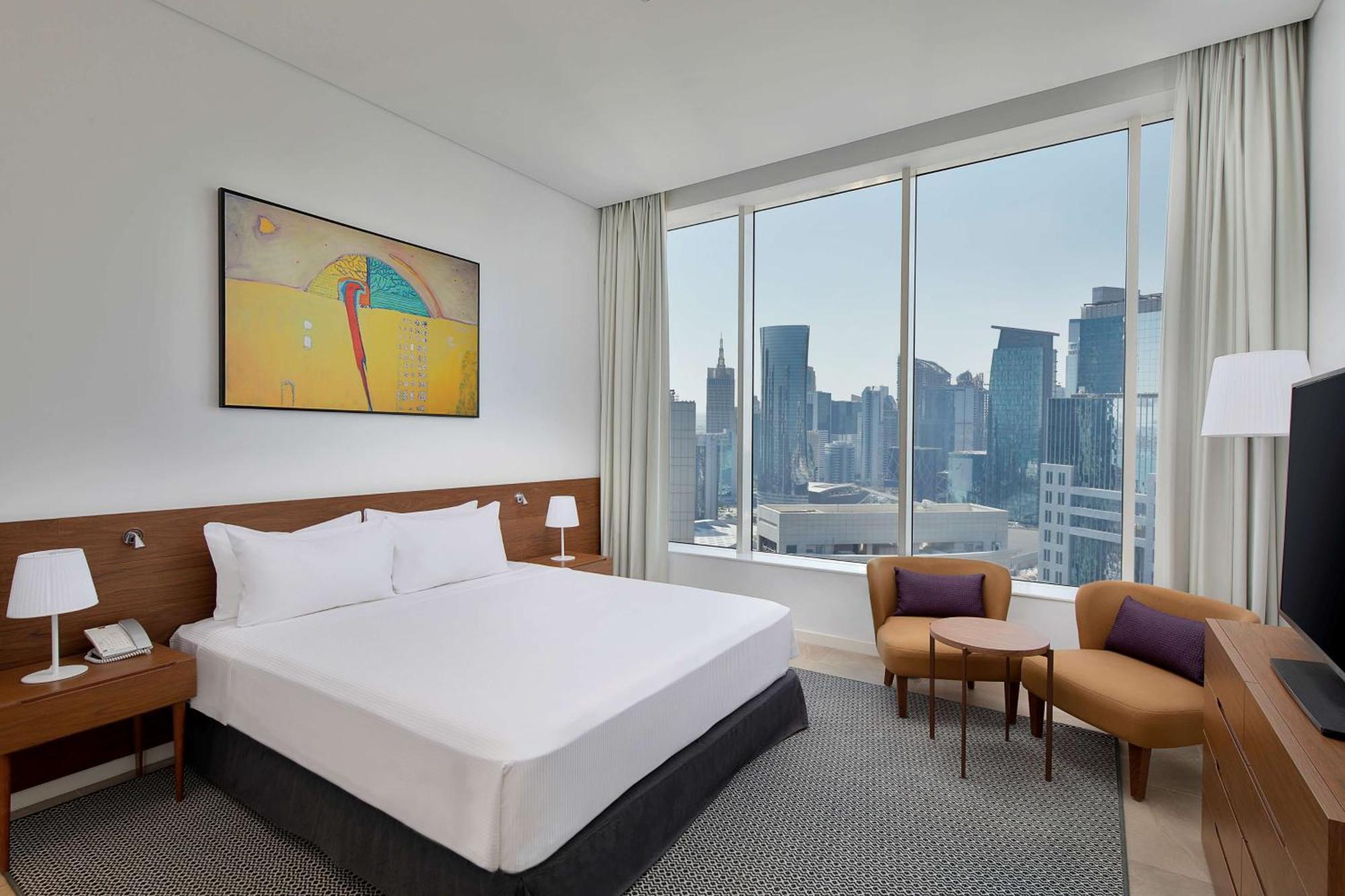 Aleph Doha Residences, Curio Collection By Hilton Ngoại thất bức ảnh A bedroom at the hotel